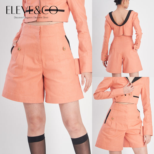 Peach-colored outfit with matching jacket and shorts on a white background, featuring the brand 'ELEVE&CO'.